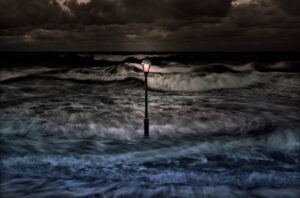 A lamp post in the middle of the ocean