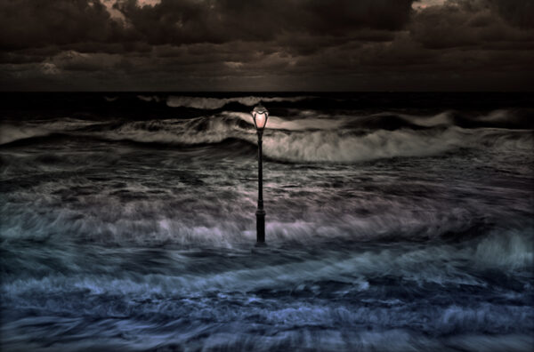 A lamp post in the middle of the ocean