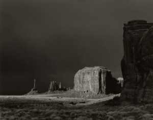 A black and white photo of the monument valley