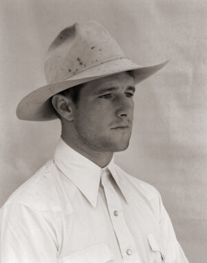 A man in a white shirt and hat