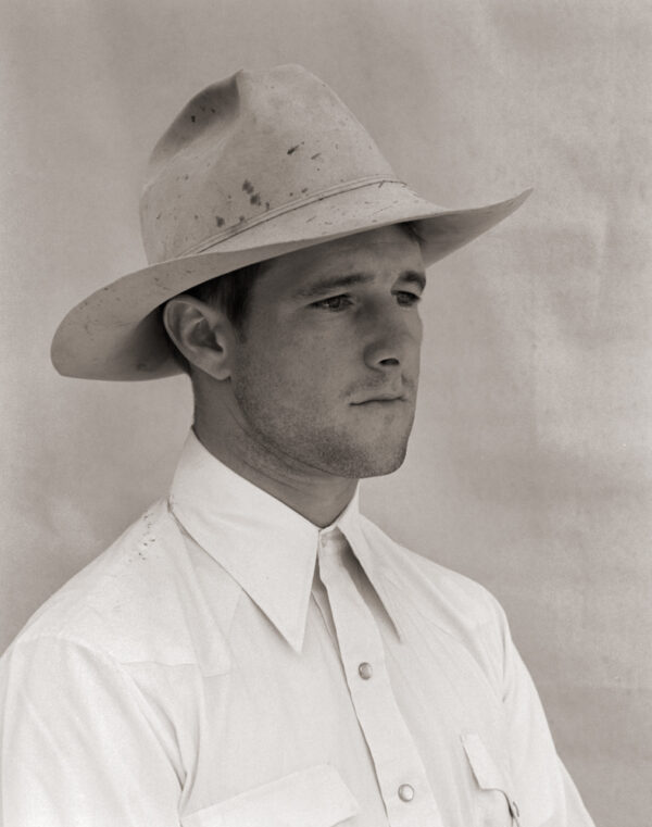 A man in a white shirt and hat