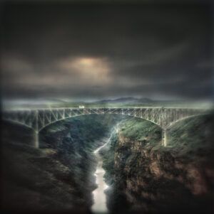 A bridge with a river running through it