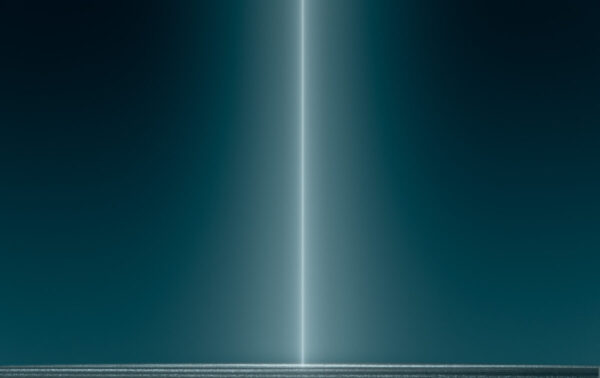 A beam of light is shining in the dark.