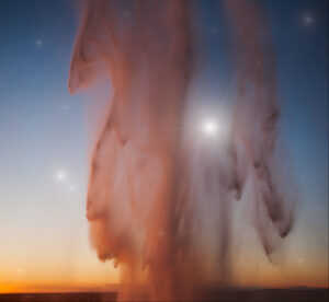 A very tall geyser in the middle of nowhere.