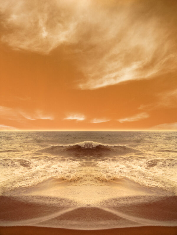 A picture of the ocean with an orange sky