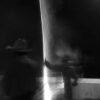 A blurry image of two people standing next to each other.