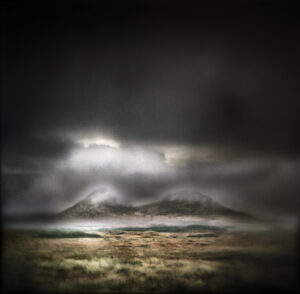A dark sky with some clouds and light