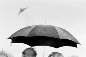 A couple of people under an umbrella