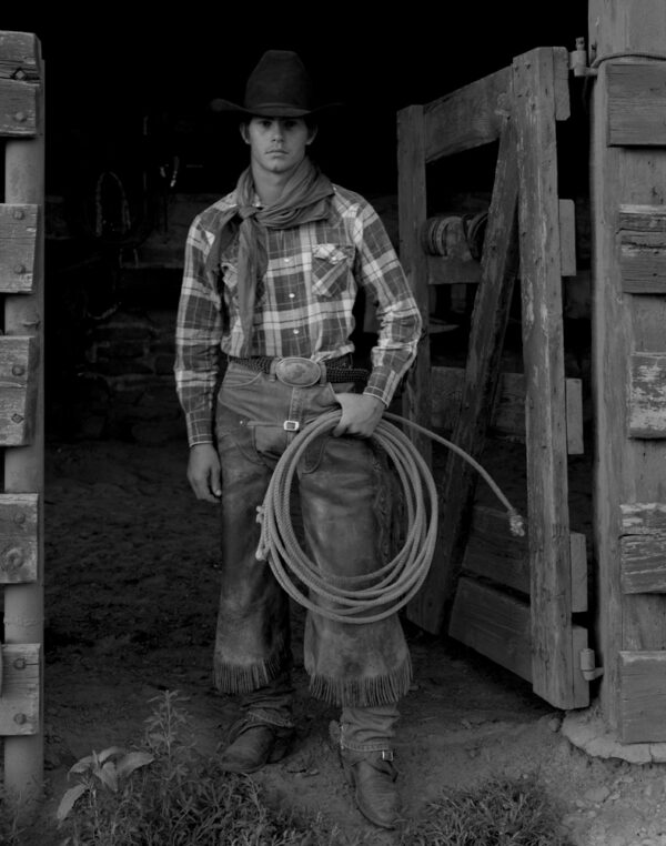 A man holding a rope in his hand.