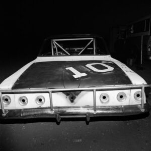 A black and white photo of an old race car.