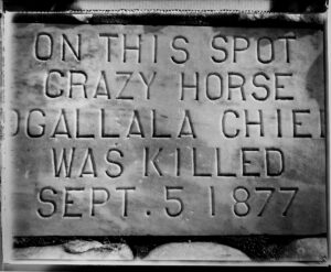 A plaque that reads " on this spot crazy horse gallala chie was killed sept. 5 1 8 7 7 ".