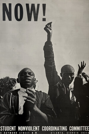 A black and white photo of people holding up their hands.