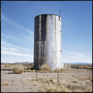 A large metal tank in the middle of nowhere.