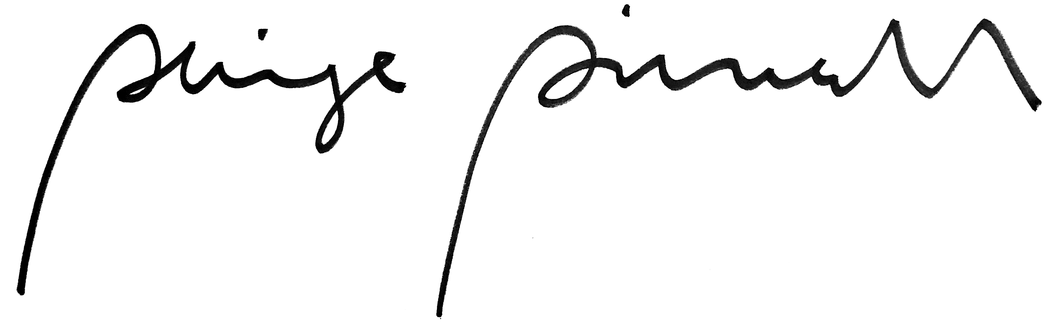 A woman and man sitting on the ground in front of a bench.