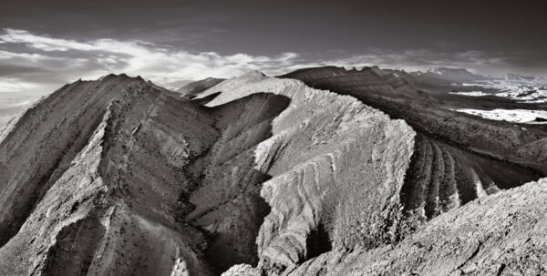A black and white photo of some mountains