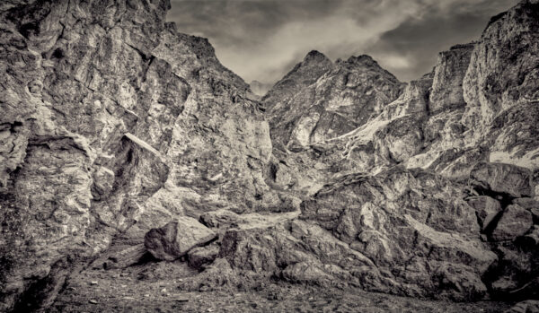 A black and white photo of some mountains