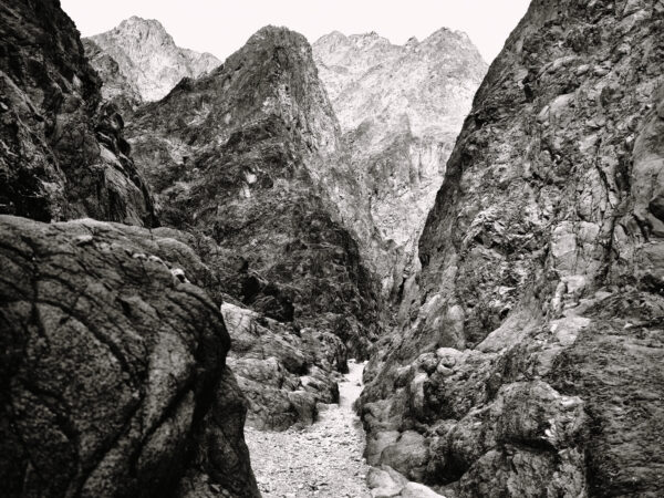 A black and white photo of some mountains