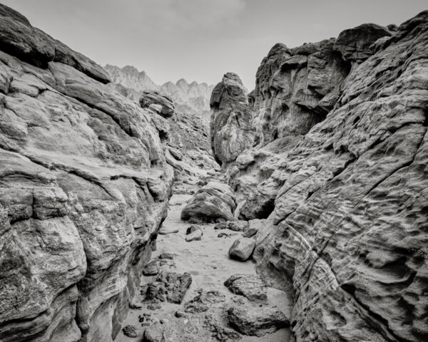 A black and white photo of rocks in the desert.