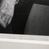 A close up of the hands and feet of an older man.