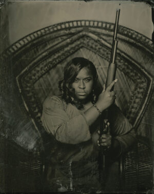 A woman holding an umbrella in her hand.