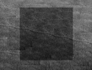 A black square is on the ground.