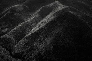 A black and white photo of some hills
