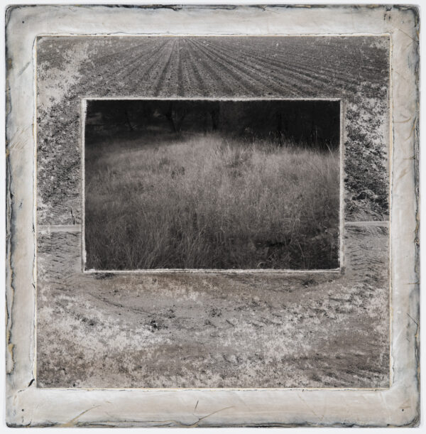 A black and white photo of an empty field.