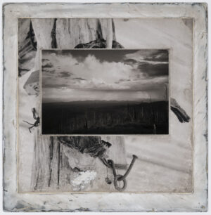 A black and white photo of the sky with clouds.