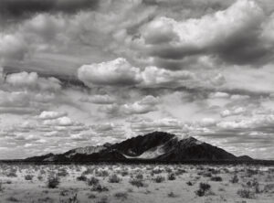 A black and white photo of a desert landscape.