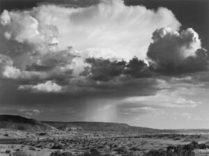 A black and white photo of a cloudy sky
