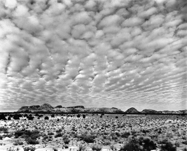 A black and white photo of some mountains
