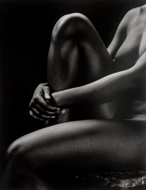 A black and white photo of a woman 's legs