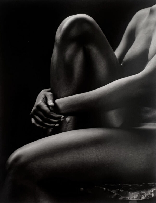 A black and white photo of a woman 's legs