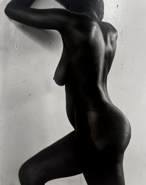 A black and white photo of a naked woman