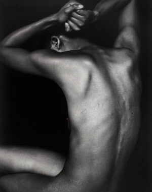 A man with his back turned to the camera.