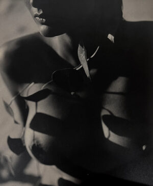 A black and white photo of a woman 's breast