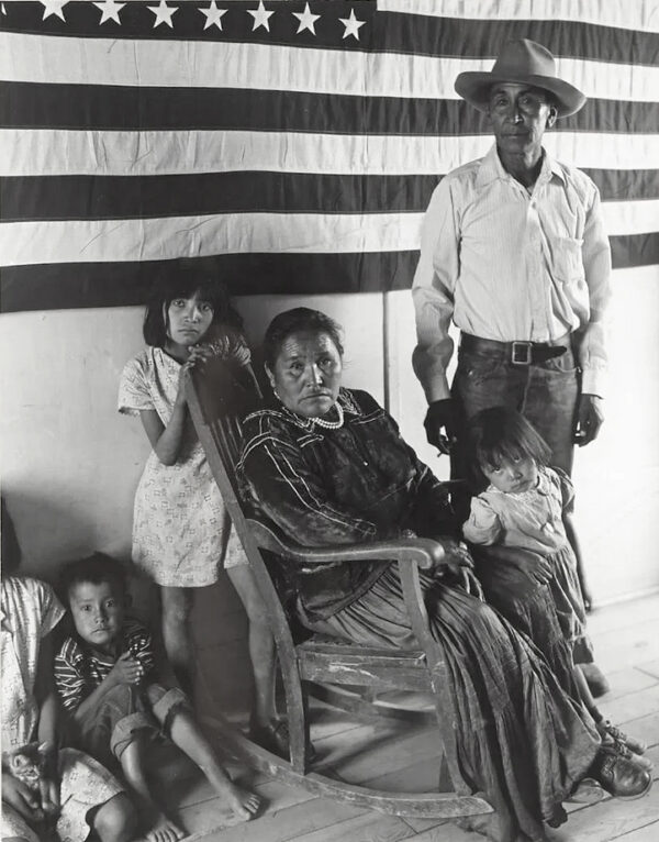 A family of four posing for the camera.