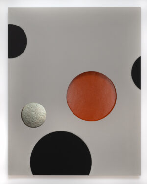 A white sheet with black and red polka dots.