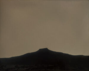 A mountain with a sky background at night