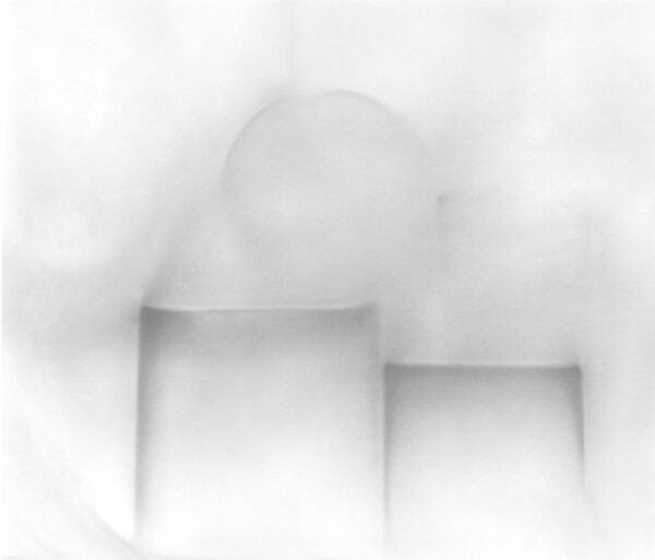 A blurry image of some white boxes and a circle.