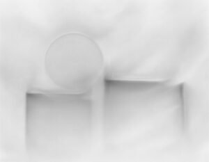 A white plate and bowl on top of a table.
