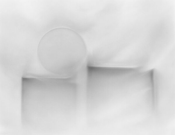 A white plate and bowl on top of a table.