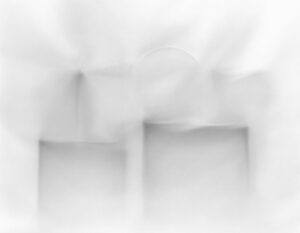 A blurry image of two windows in the window.