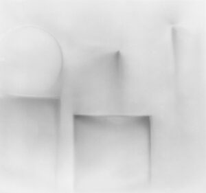 A white wall with some shapes in it