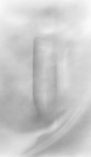 A blurry image of a pillar in the middle of a room.