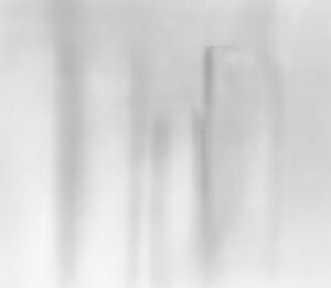 A blurry image of the back side of a building.