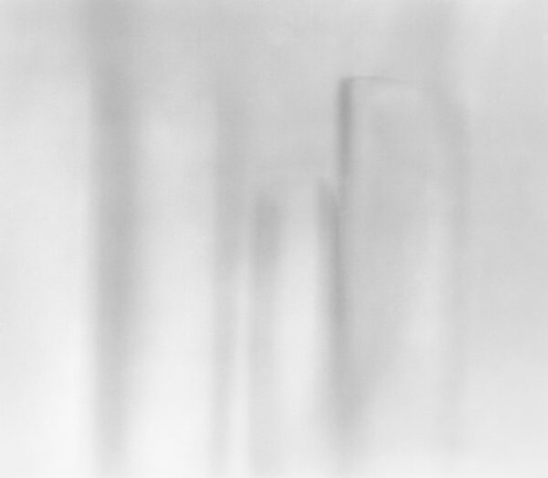 A blurry image of the back side of a building.