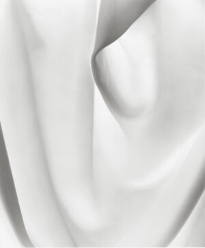 A white cloth that is folded up and has some folds.