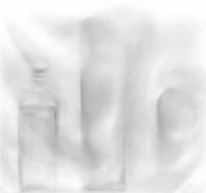 A blurry image of some white objects in the air.
