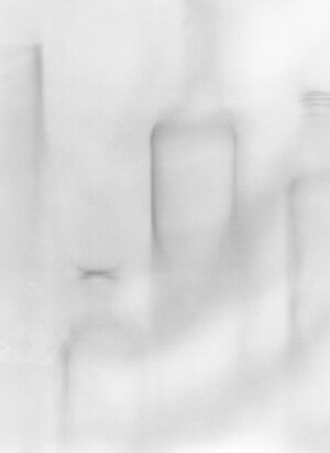 A blurry image of a room with white walls.